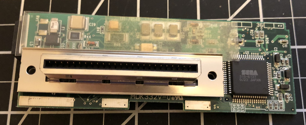 Dreamcast modem PCB with connector shield attached